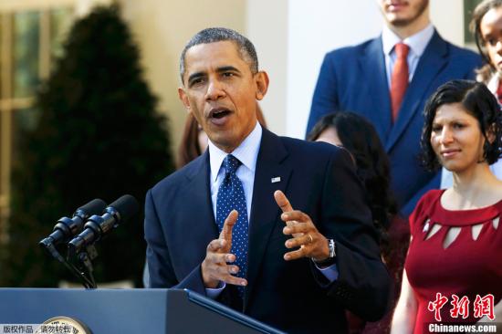 资料图：2013年，时任美国总统奥巴马宣传医改法案。
