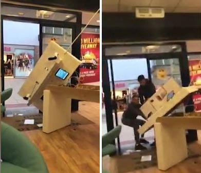 英国四名歹徒抢劫手机店 试图拽走整个展示台