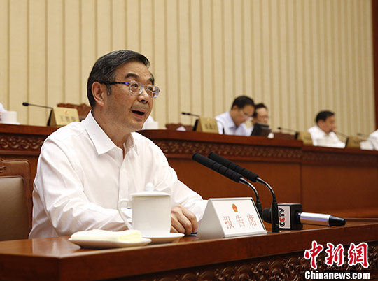 资料图：周强作最高人民法院关于人民陪审员制度改革试点情况的中期报告。 <a target='_blank' href='http://www.chinanews.com/'>中新社</a>记者 杜洋 摄