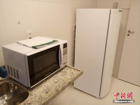 厨房里有简单的家用电器。 <a target='_blank' href='http://www.chinanews.com/'>中新社</a>记者 卢岩 摄