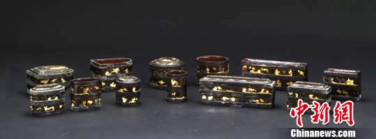 汉代·银扣金银箔贴饰云气鸟兽纹漆奁。扬州博物馆供图