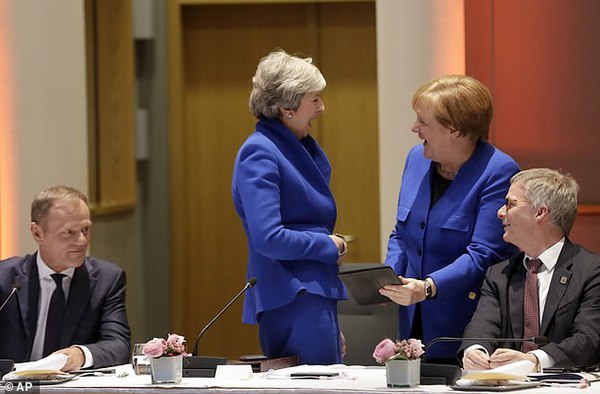 1554951372664515.jpg 12107910-6908511-Mrs_May_shared_a_joke_with_German_chancellor_Angela_Merkel_tonig-a-25_1554920325555.jpg