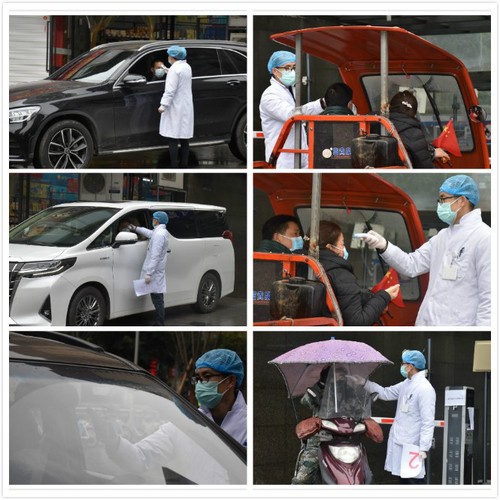 谭晓鹏为进出小区的居民做体温监测