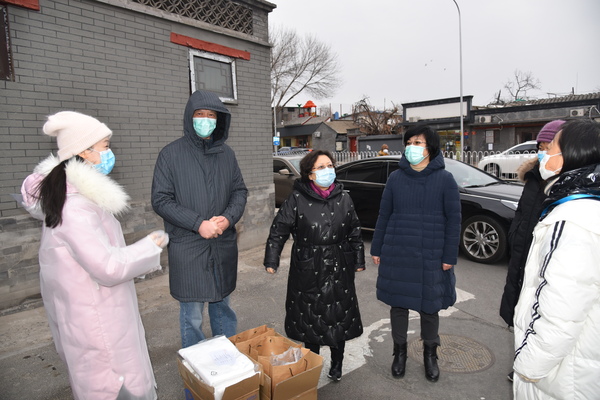 1民革市委主委王红参与社区防控