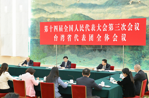 3月7日下午，中共中央政治局常委、全国政协主席王沪宁参加十四届全国人大三次会议台湾代表团审议。新华社记者 高洁 摄